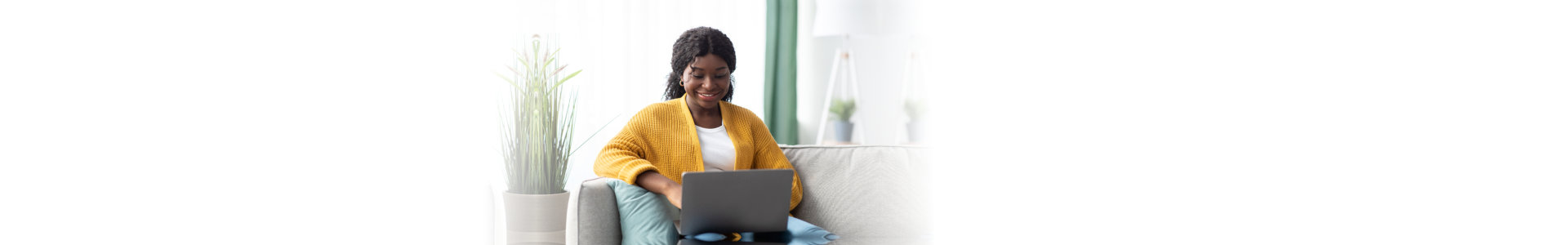 woman using laptop and smiling